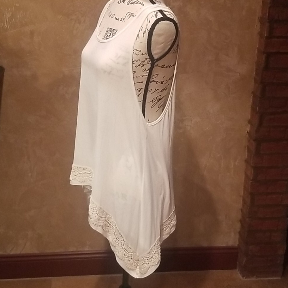 Off-white tank top style blouse with lace hem
